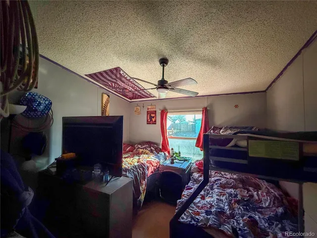 a view of a balcony with a table and chairs