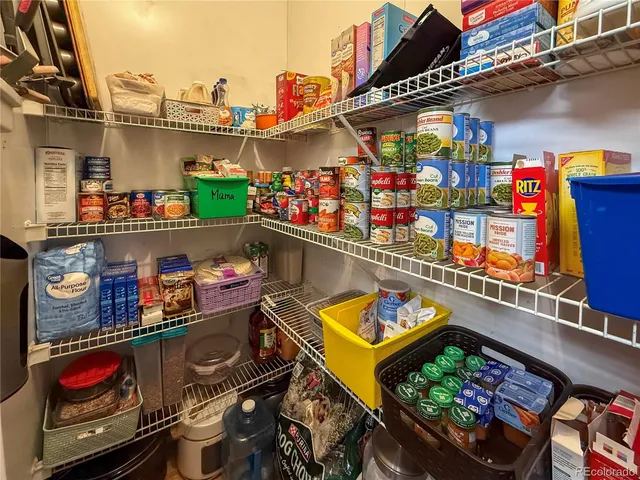 a open kitchen with stainless steel appliances granite countertop a sink dishwasher stove refrigerator and cabinets