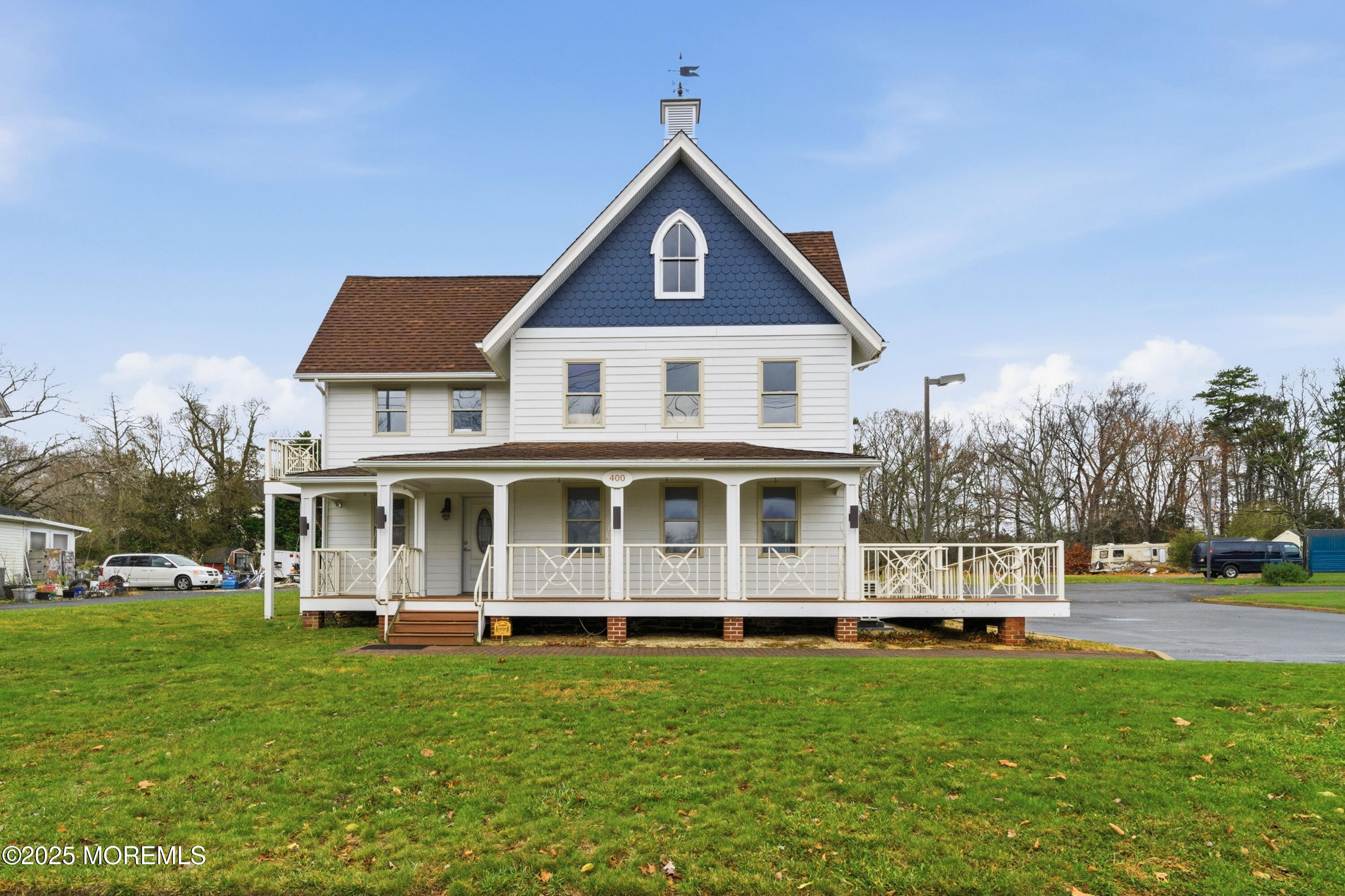 400 Main Street, Unit 2 West Creek, NJ 08092 - Photo 1 of 22 a front view of a house with a yard