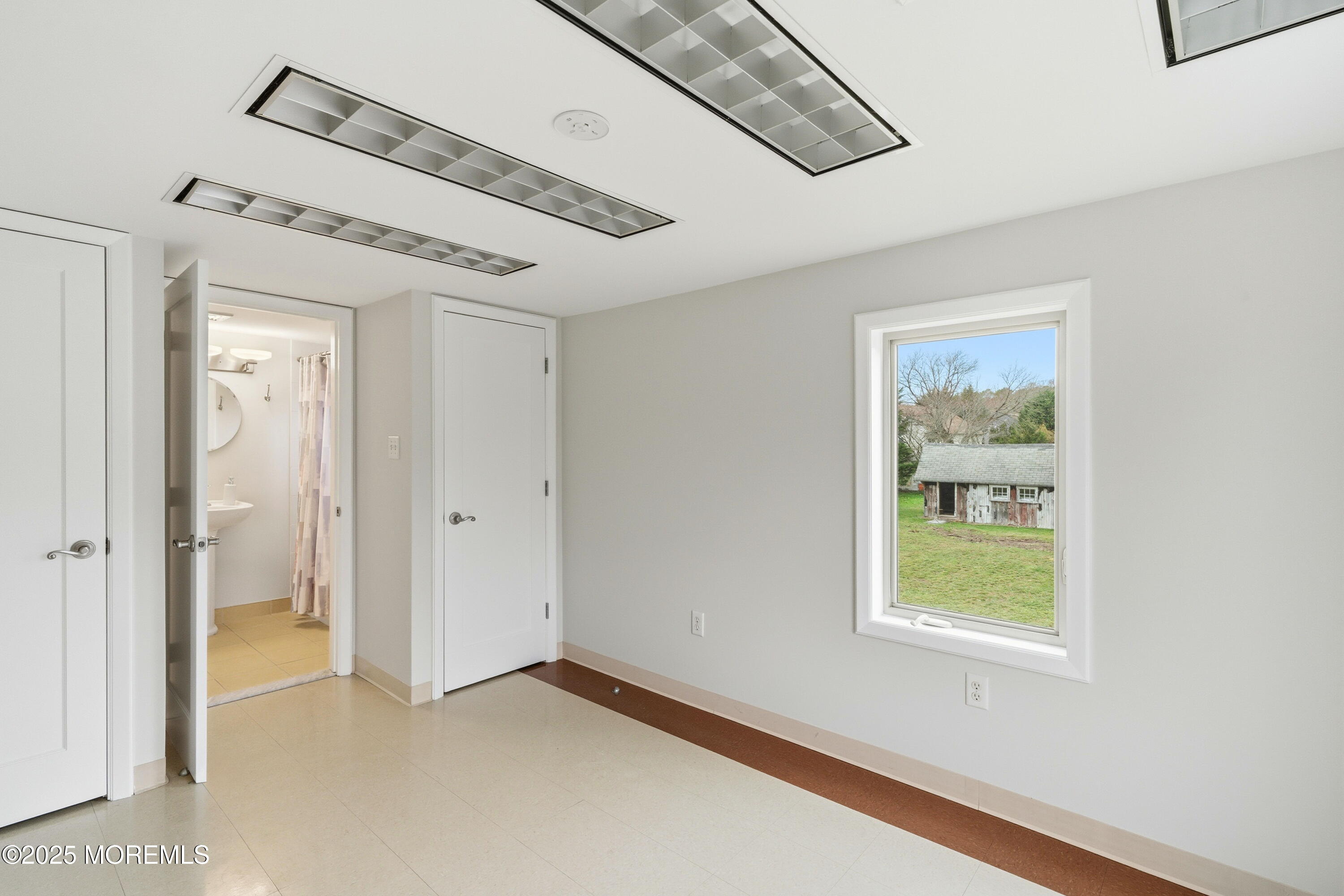 400 Main Street, Unit 2 West Creek, NJ 08092 - Photo 14 of 22 a view of an empty room with a window