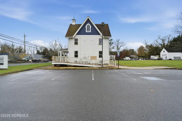 a front view of a house with a yard table and chairs