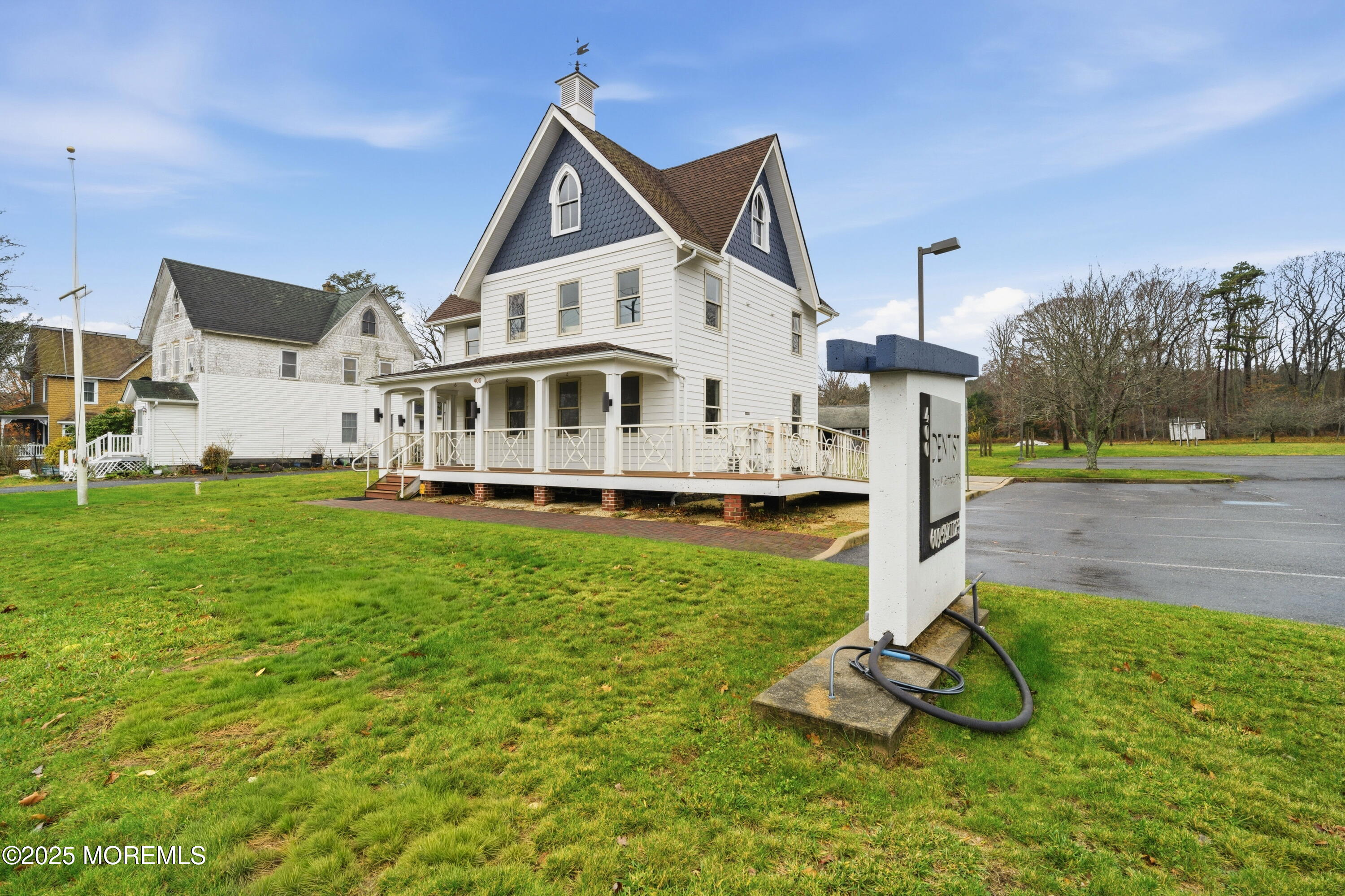 400 Main Street, Unit 2 West Creek, NJ 08092 - Photo 18 of 22 a front view of a house with garden