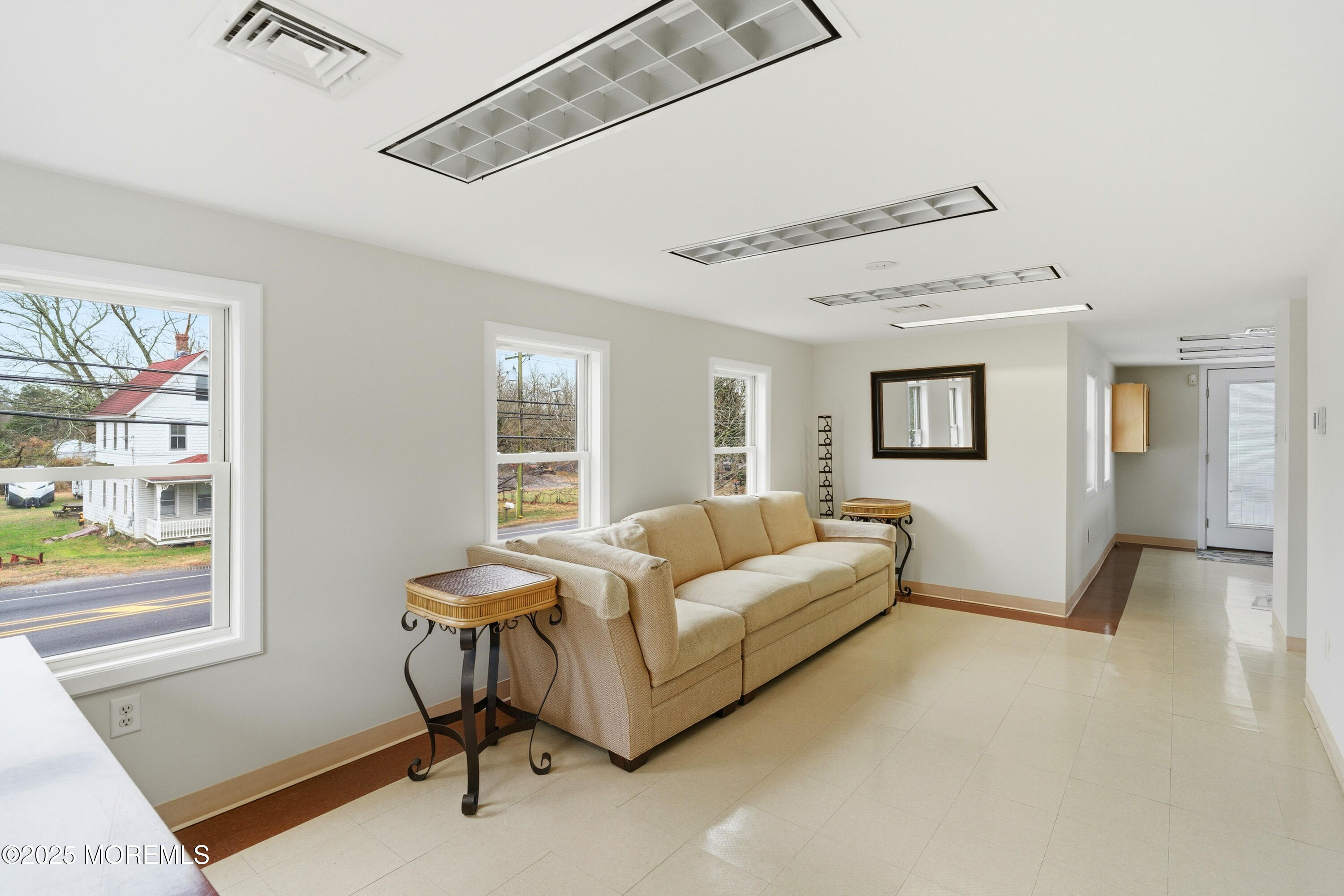 400 Main Street, Unit 2 West Creek, NJ 08092 - Photo 3 of 22 a living room with furniture and a window
