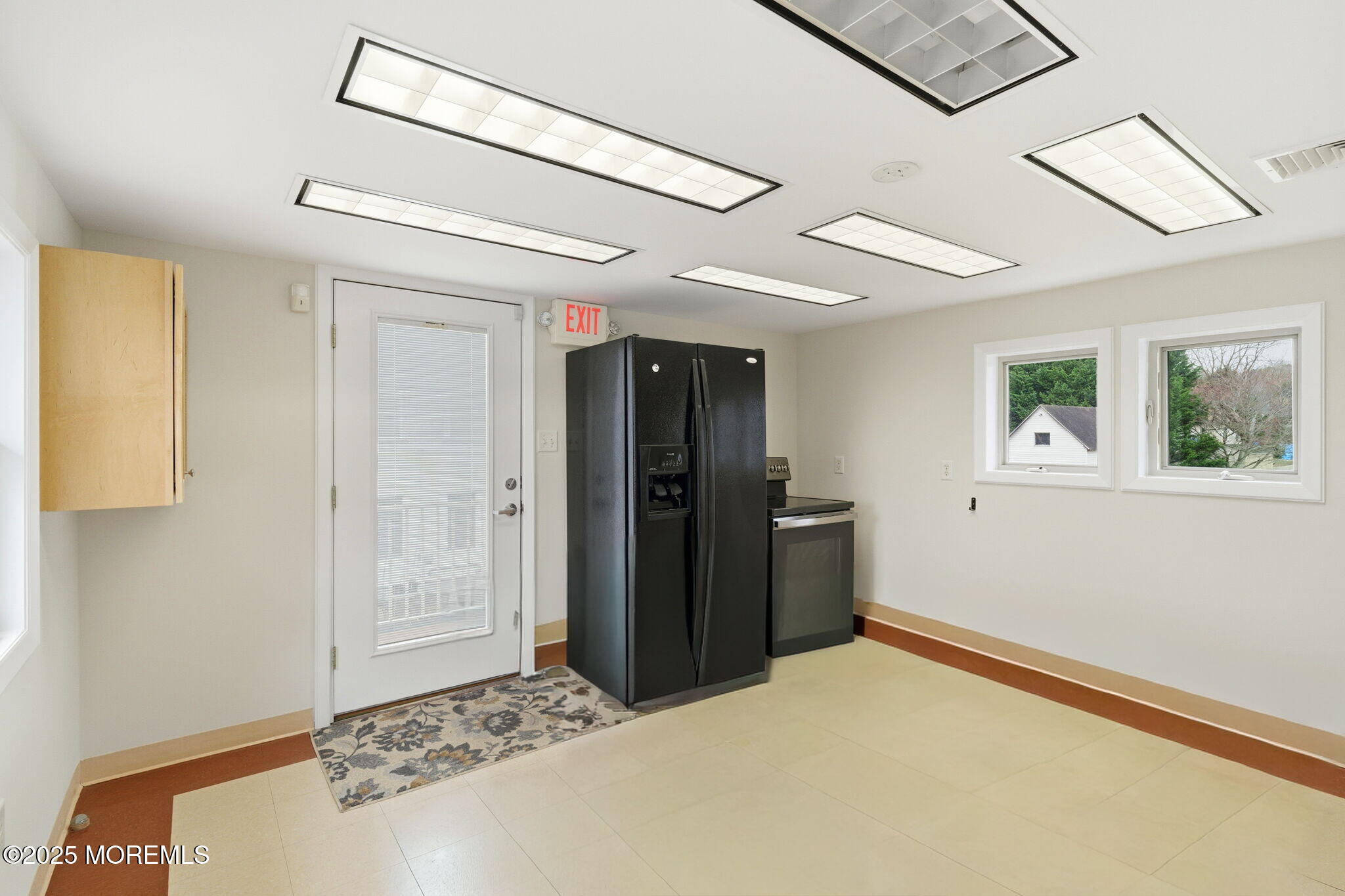 400 Main Street, Unit 2 West Creek, NJ 08092 - Photo 6 of 22 a bedroom with a bed and a window