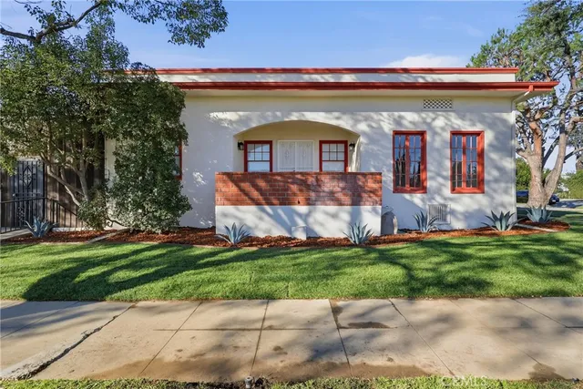 a view of wooden floor and windows in a room