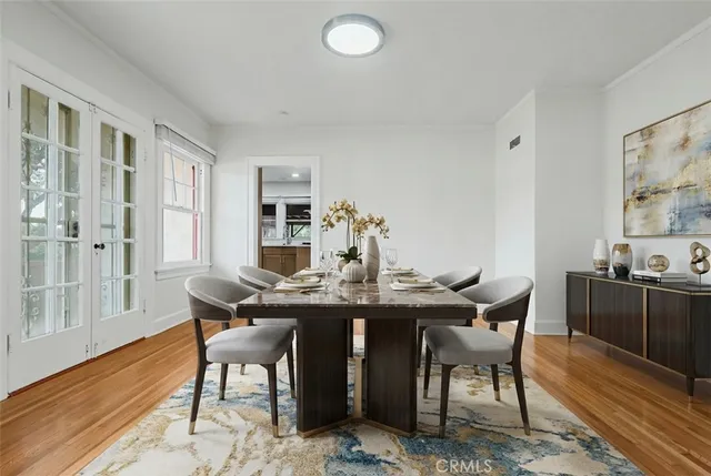 a large white kitchen with kitchen island a refrigerator a sink and a stove