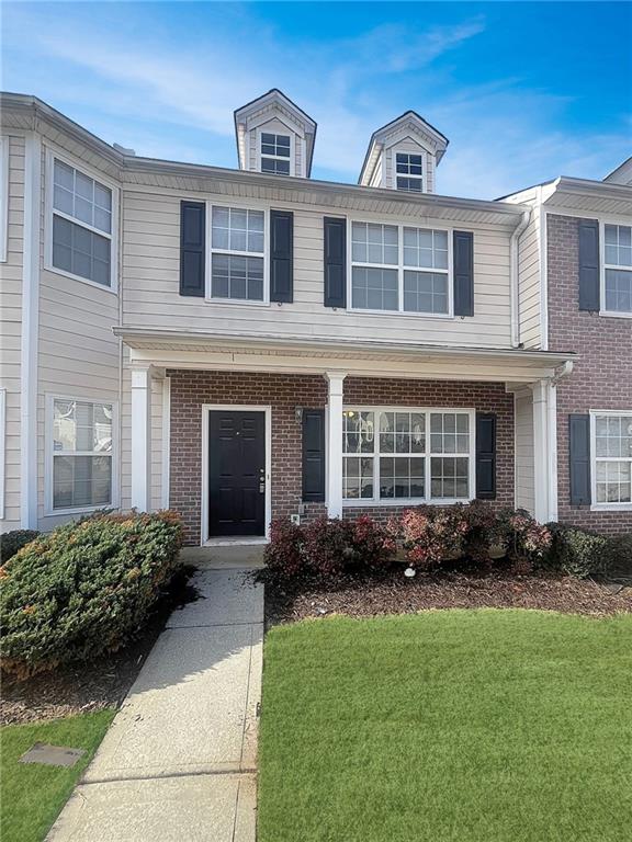4205 Legacy Square Atlanta, GA 30349 - Photo 1 of 1 a front view of a house with garden