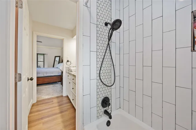 a en suite bathroom with a shower and tub