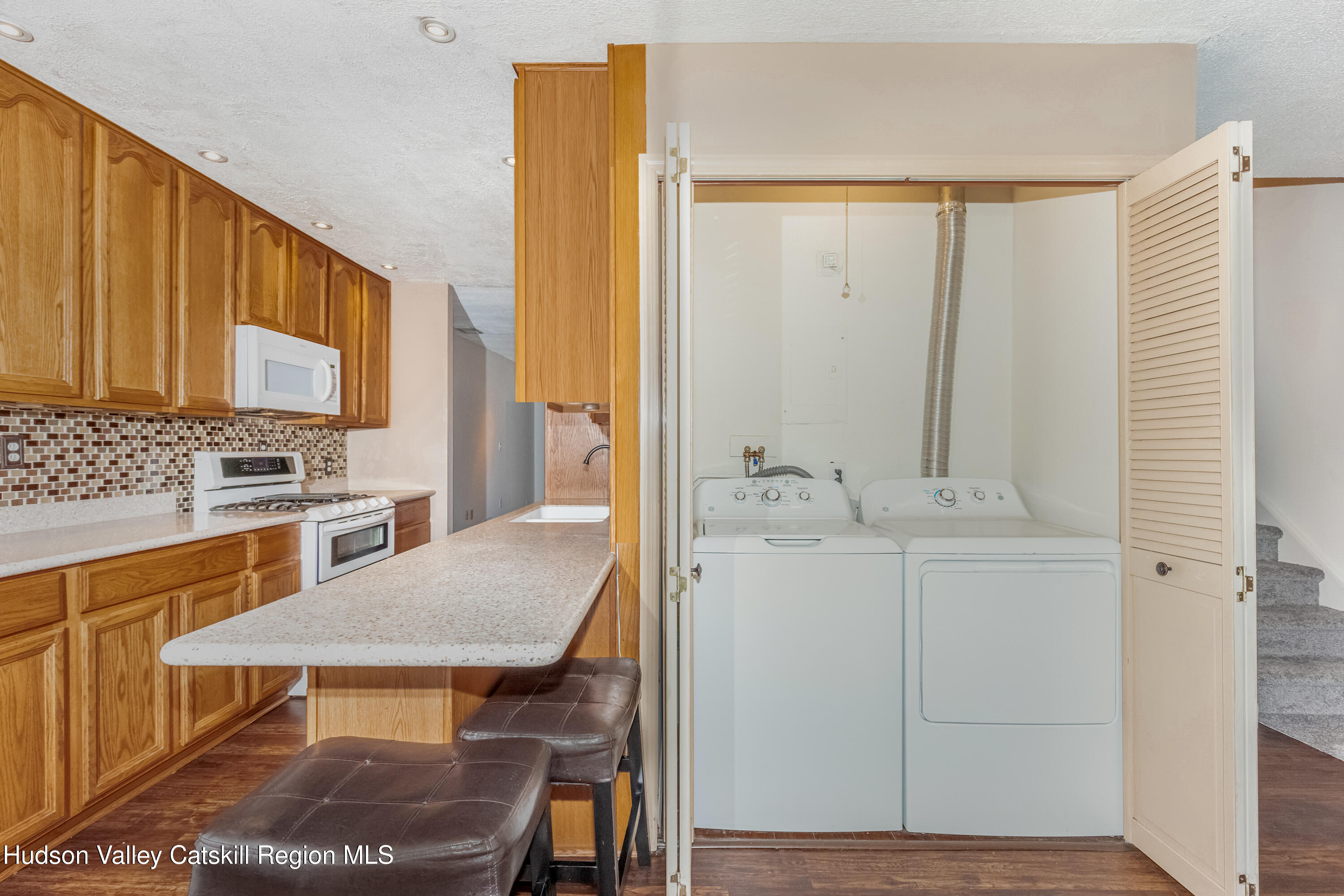 1907 Magnolia Walk Poughkeepsie, NY 12603 - Photo 14 of 36 a kitchen with a table chairs and entryway