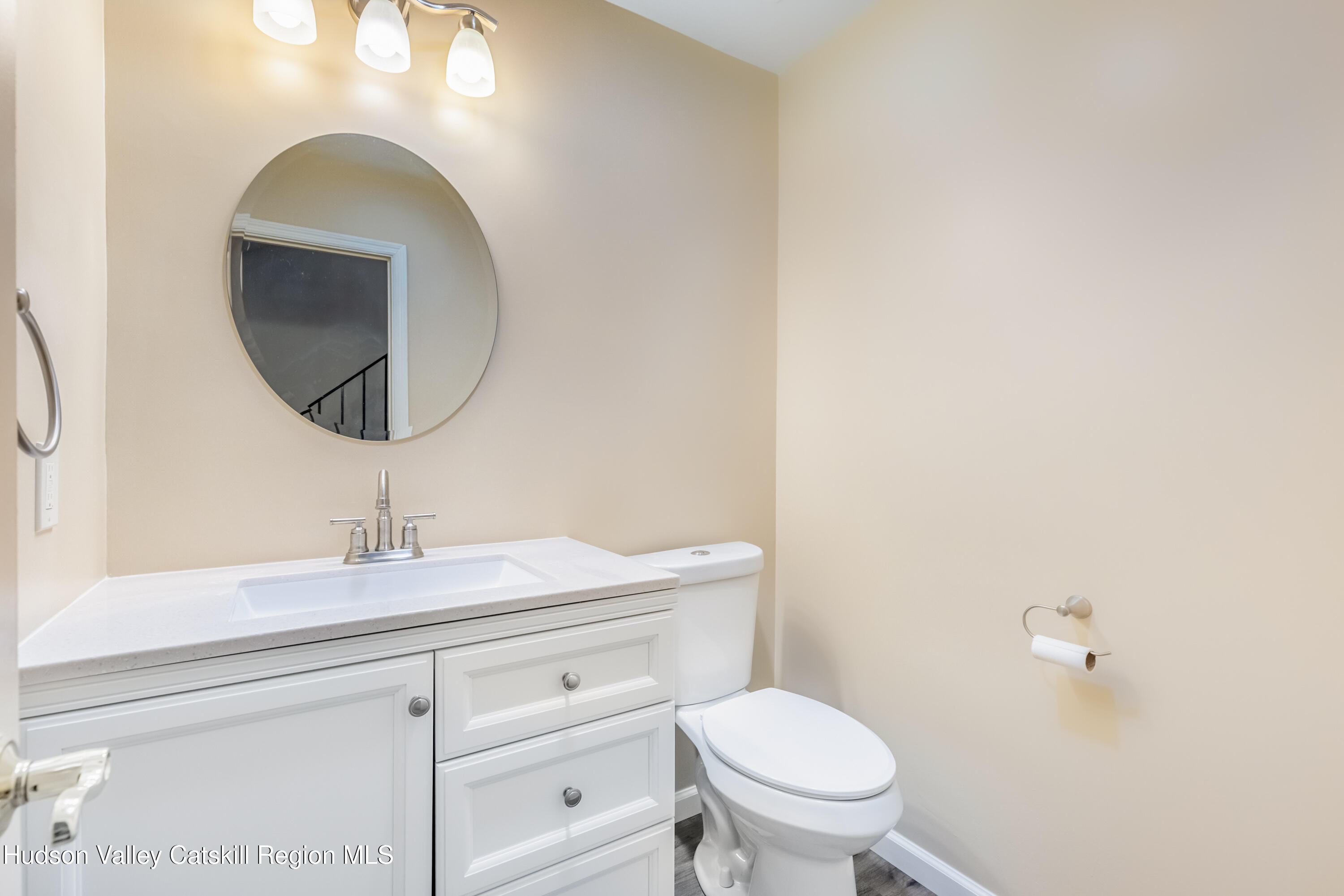 1907 Magnolia Walk Poughkeepsie, NY 12603 - Photo 17 of 36 a bathroom with a toilet sink and mirror