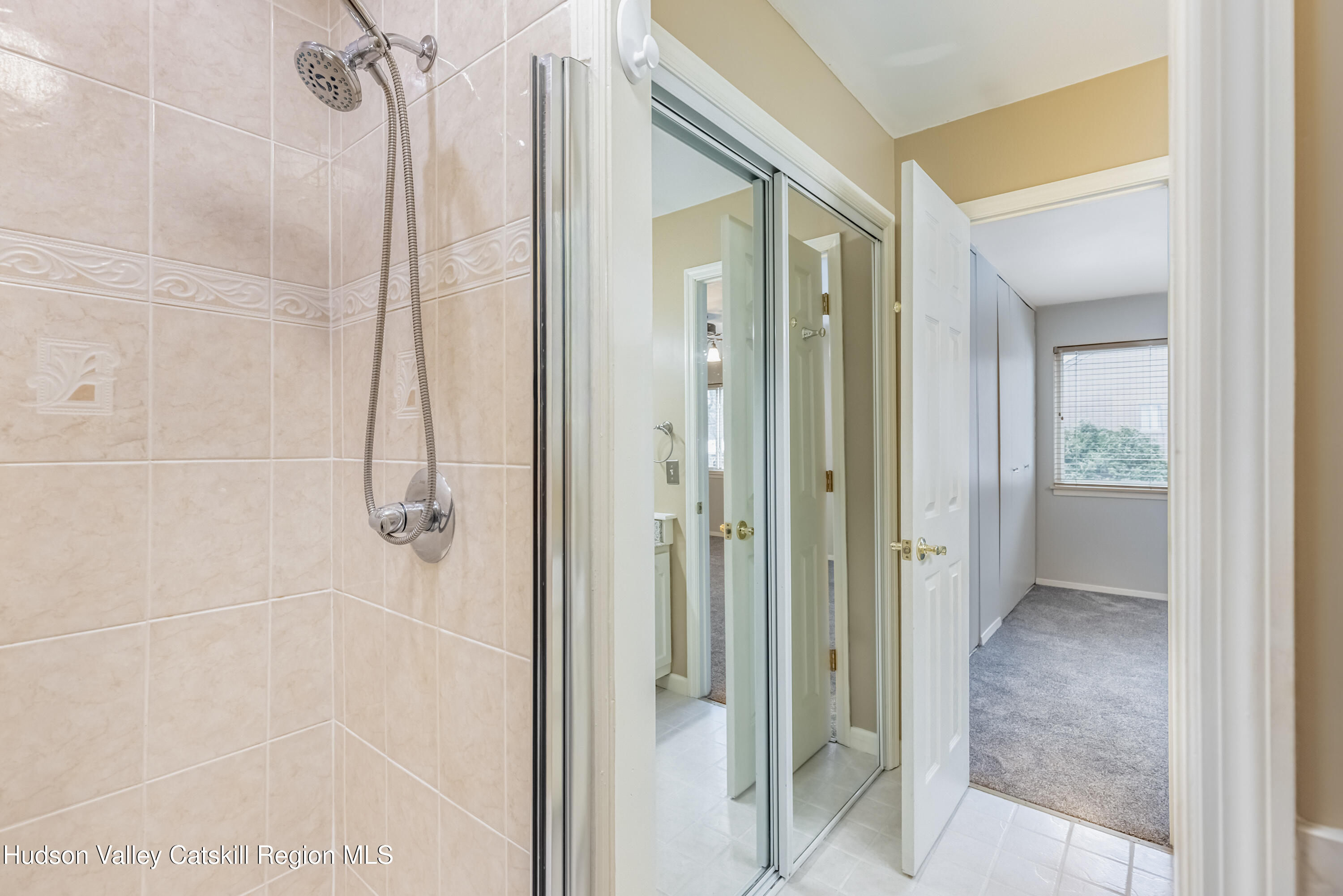 1907 Magnolia Walk Poughkeepsie, NY 12603 - Photo 25 of 36 a bathroom with a glass shower door