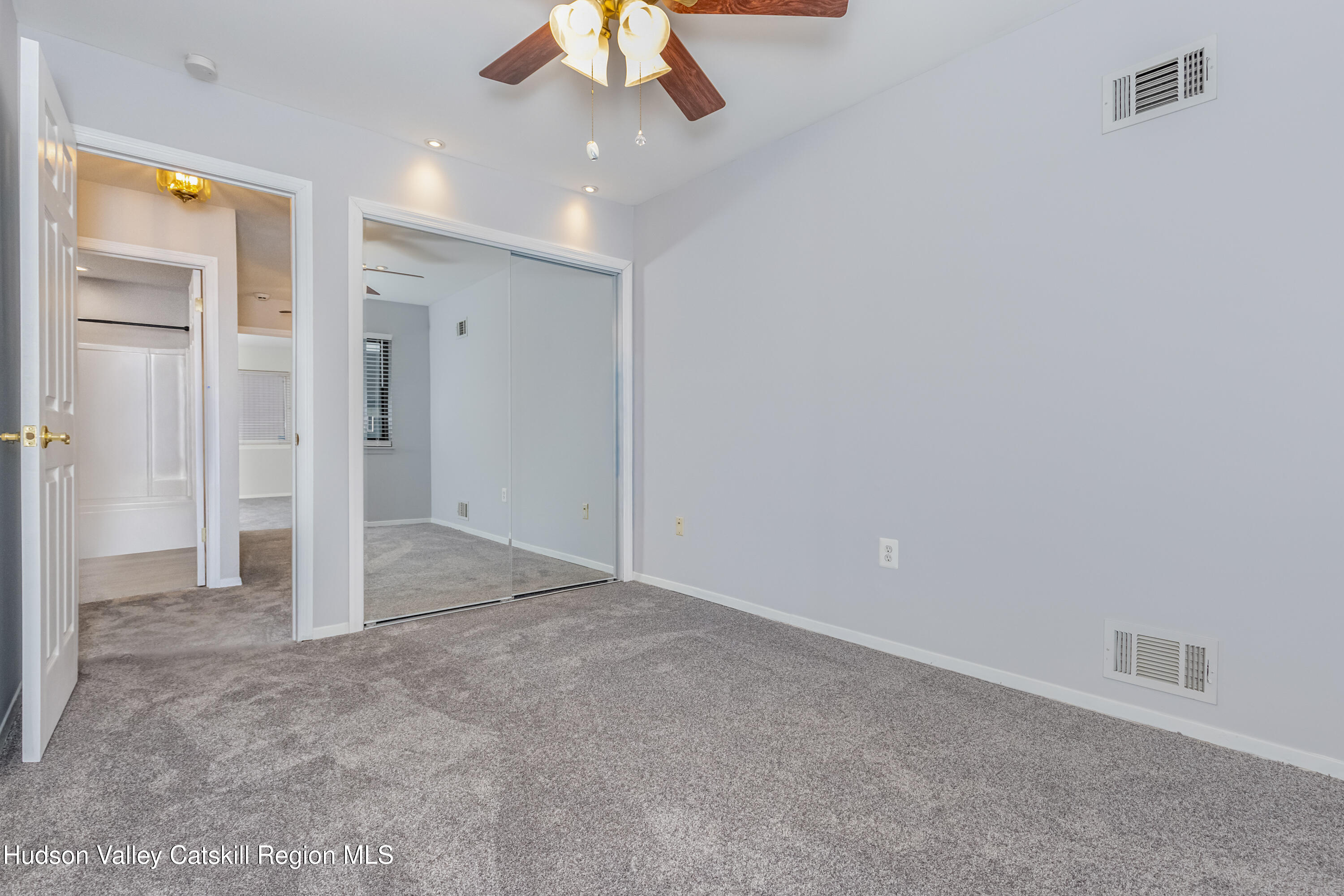 1907 Magnolia Walk Poughkeepsie, NY 12603 - Photo 31 of 36 en empty room with a ceiling fan and a bathroom