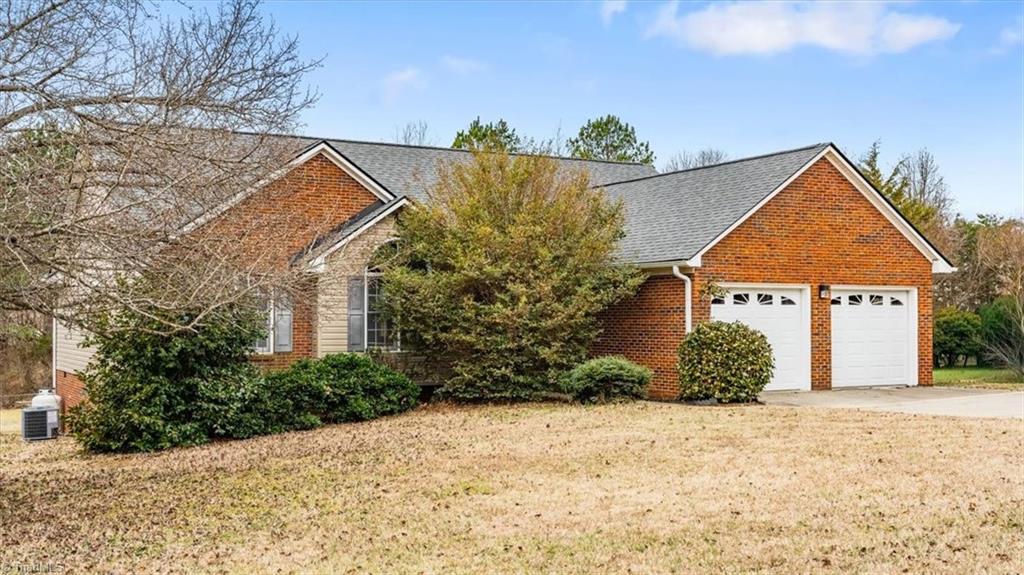 6933 Lawrence Farm Lane Randleman, NC 27317 - Photo 2 of 33 COME SPRING THE LARGE BUSH LOOKS AMAZING
