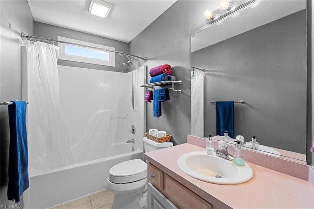 6933 Lawrence Farm Lane Randleman, NC 27317 - Photo 23 of 33 2ND BATH WITH A TUB/SHOWER AND A TANSOME WINDOW