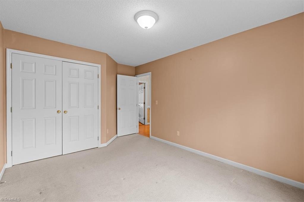 6933 Lawrence Farm Lane Randleman, NC 27317 - Photo 25 of 33 THIRD BEDROOM WITH A LARGE CLOSET.