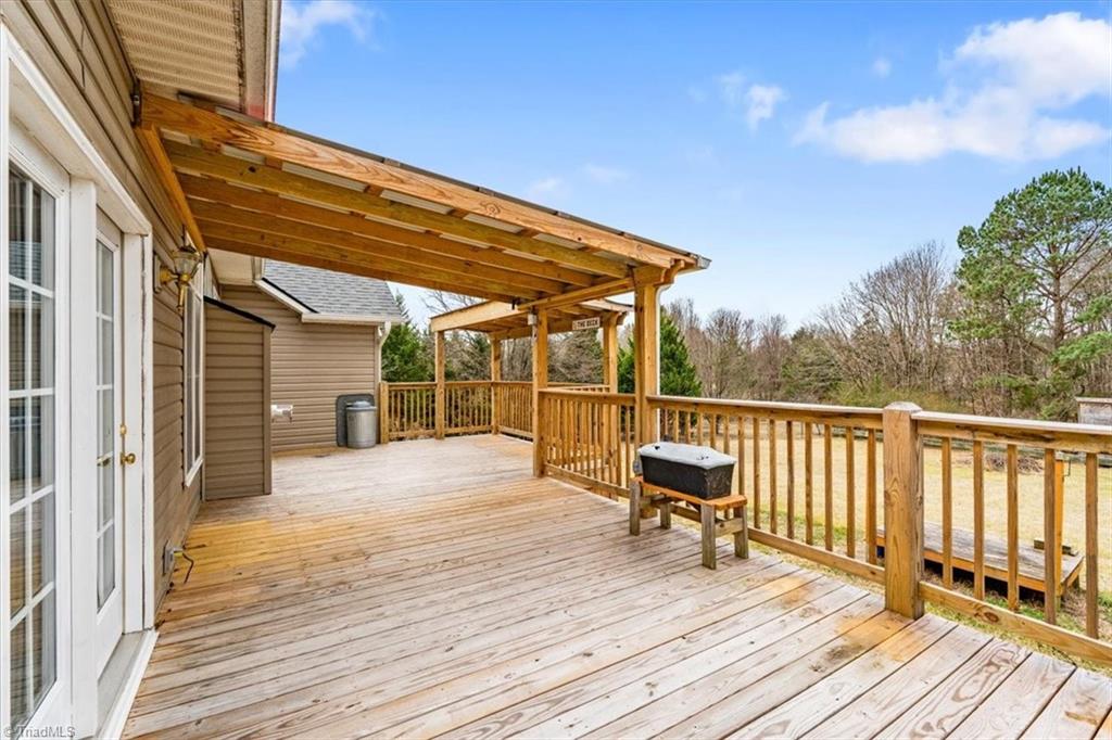 6933 Lawrence Farm Lane Randleman, NC 27317 - Photo 28 of 33 THIS IS A HUGE DECK. THE SELLER RECENTLY HAD THIS DECK BUILT
