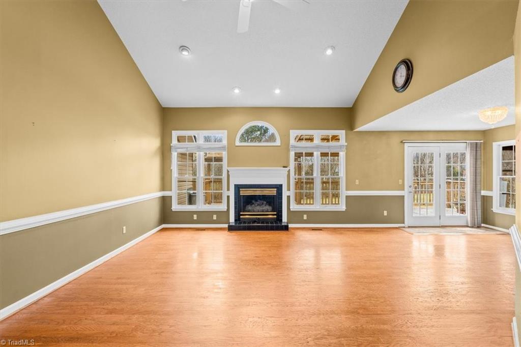 6933 Lawrence Farm Lane Randleman, NC 27317 - Photo 3 of 33 THE FAMILY ROOM HAS VAULTED CEILINGS WHICH GIVE THIS ROOM A VERY OPEN AND AIRY FEEL.