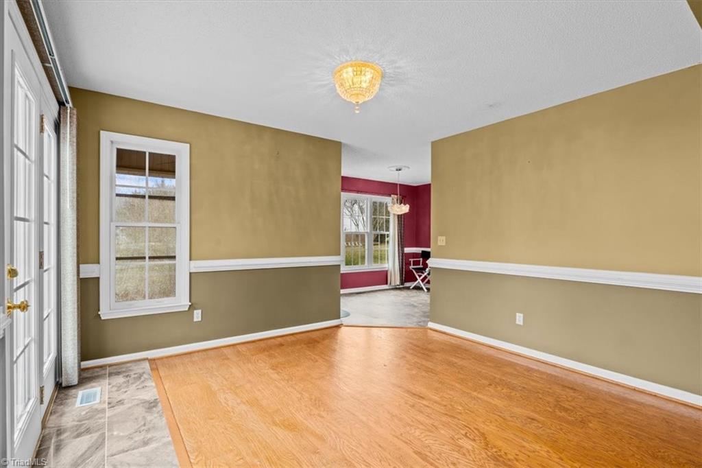 6933 Lawrence Farm Lane Randleman, NC 27317 - Photo 8 of 33 YOUR FAMILY ROOM FLOWS INTO THE DINING AREA WHICH IS GREAT FOR ENTERTAINING