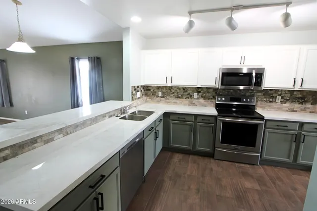 a kitchen with a stove and a sink