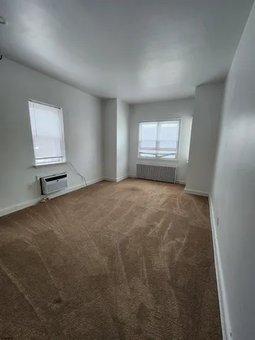 a view of an empty room and window