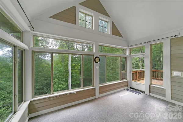 a view of an entryway with a floor to ceiling window