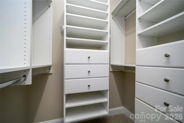 a view of an empty walk in closet
