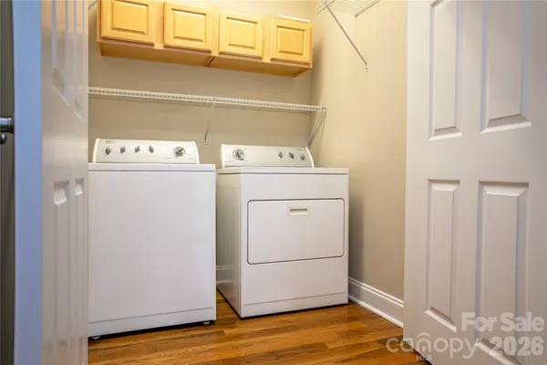en empty room with windows and ceiling fan
