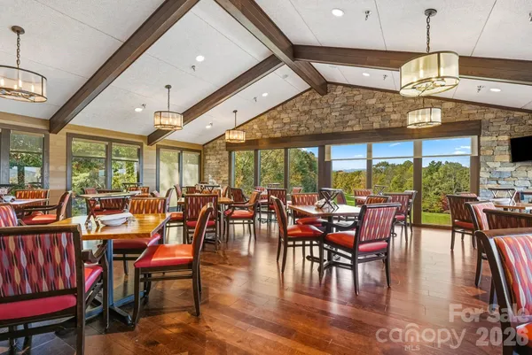 a view of a city from a balcony with furniture