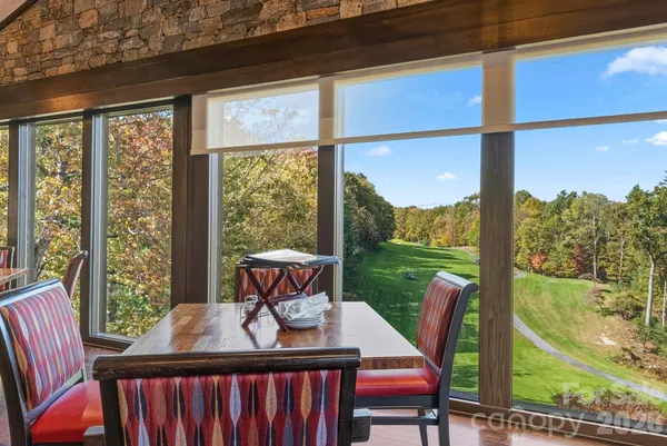 a view of a dining room and furniture window and outside view