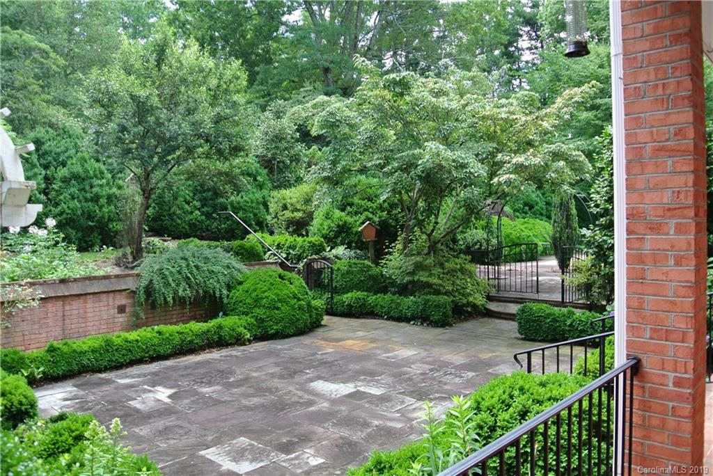 208 Pellyn Wood Road Rutherfordton, NC 28139 - Photo 12 of 18 a view of a garden with a bench