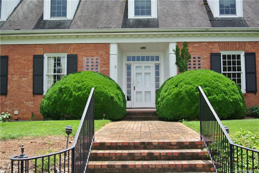 208 Pellyn Wood Road Rutherfordton, NC 28139 - Photo 17 of 18 a front view of a house with garden