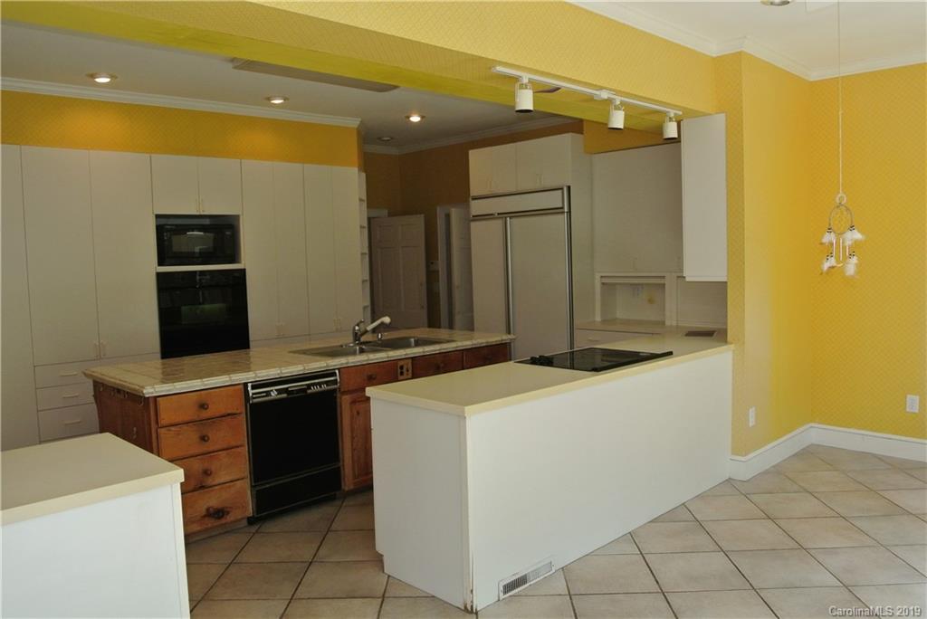 208 Pellyn Wood Road Rutherfordton, NC 28139 - Photo 9 of 18 a kitchen that has a sink and a stove in it