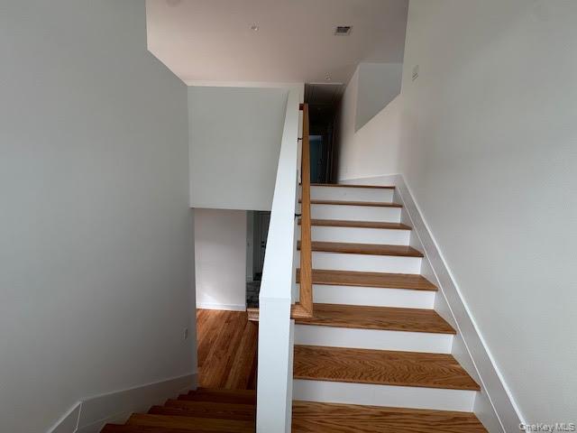 11 Colonels Path Manorville, NY 11949 - Photo 28 of 49 stairs to the open loft area that lead to additional bedrooms and laundry room