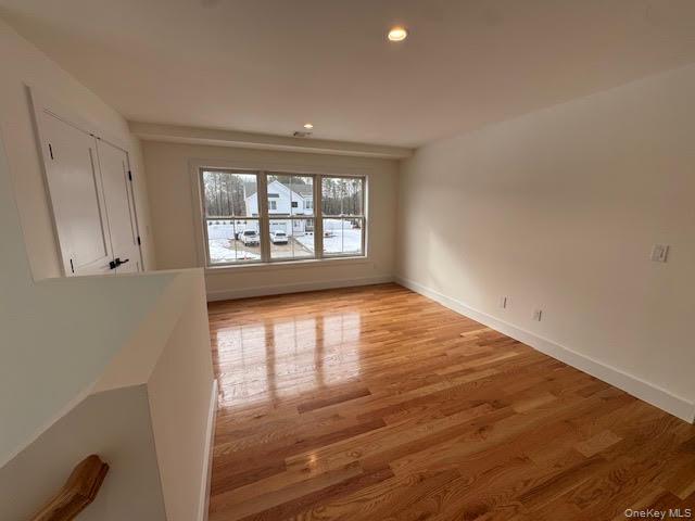 11 Colonels Path Manorville, NY 11949 - Photo 30 of 49 Spare room can be used as office or playroom featuring light wood finished floors and recessed lighting, large closet