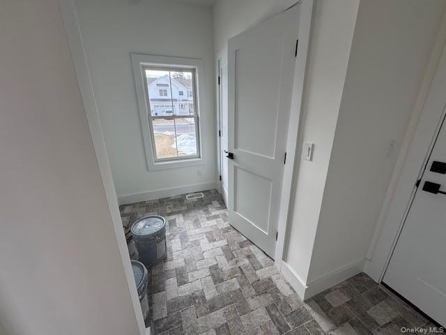 11 Colonels Path Manorville, NY 11949 - Photo 5 of 49 coat closet and interior garage door entrance