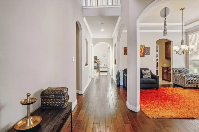 a view of living room with furniture and wooden floor