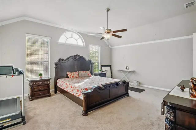 a bedroom with a bed and dresser