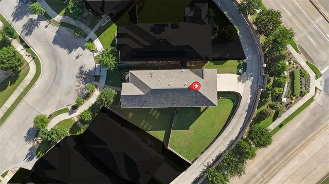 an aerial view of a house with outdoor space