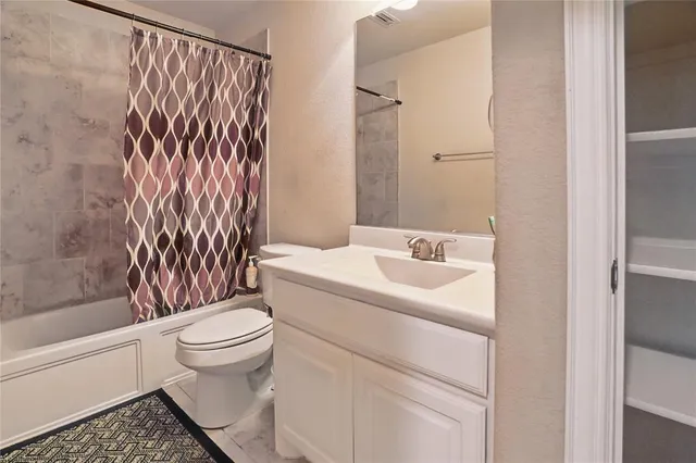 a room with a closet and a wooden floor