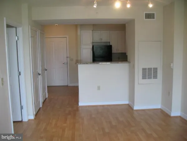 a view of a livingroom with wooden floor