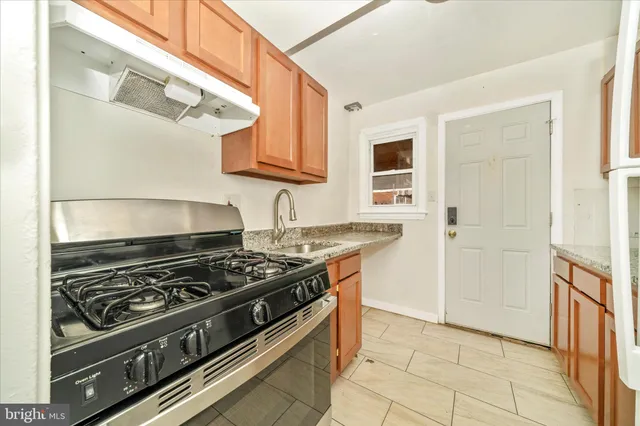 a kitchen with a stove and a cabinet