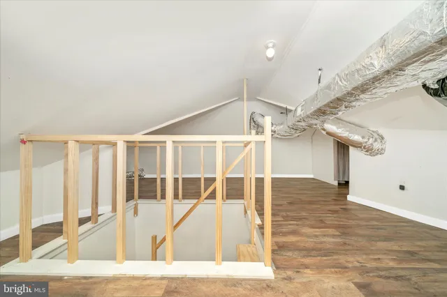 a view of a porch with wooden floor and fence