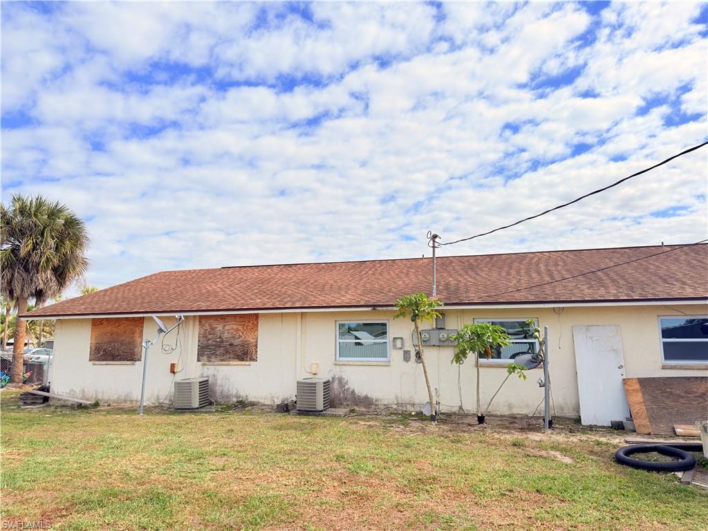 2241 Sunshine Boulevard Naples, FL 34116 - Photo 20 of 35 a view of a house with a swimming pool and furniture