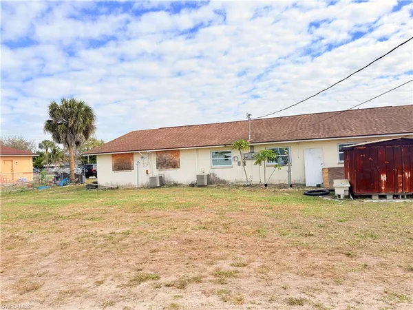 a view of a backyard of the house