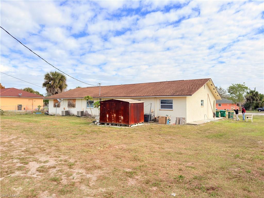 2241 Sunshine Boulevard Naples, FL 34116 - Photo 23 of 35 a big house with a big yard and large trees