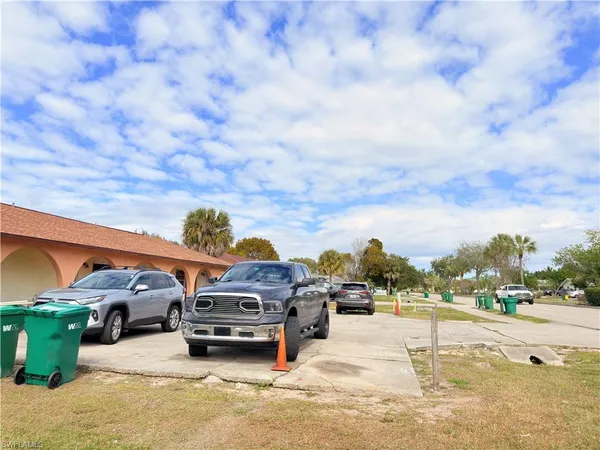 a view of a backyard with a car parked