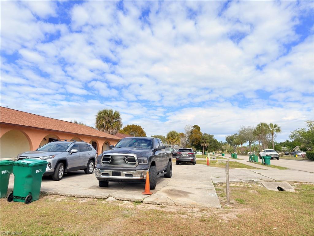 2241 Sunshine Boulevard Naples, FL 34116 - Photo 27 of 35 a view of parking with cars parked