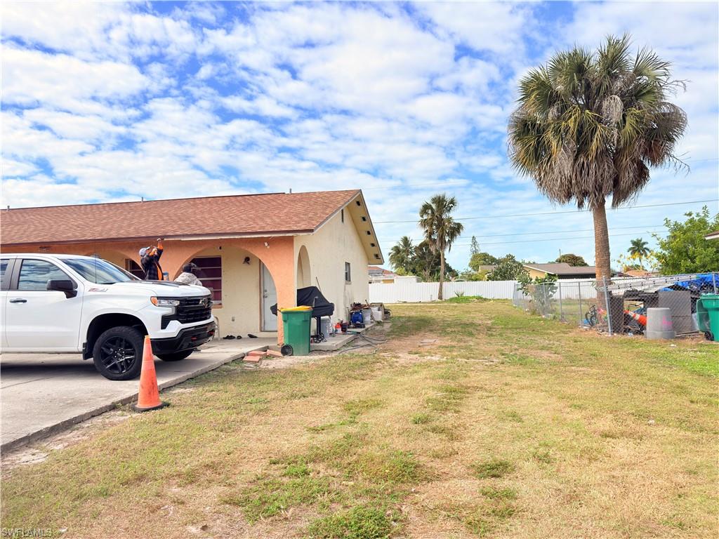 2241 Sunshine Boulevard Naples, FL 34116 - Photo 29 of 35 a view of a backyard with a car parked