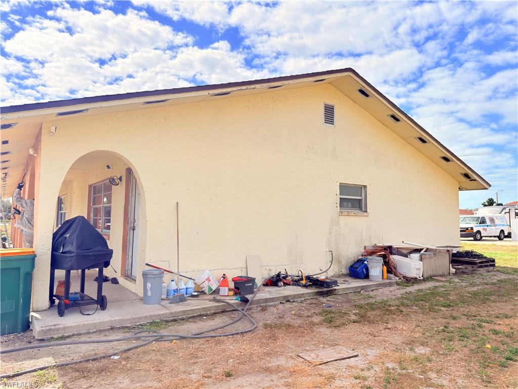 2241 Sunshine Boulevard Naples, FL 34116 - Photo 32 of 35 a front view of a house with backyard