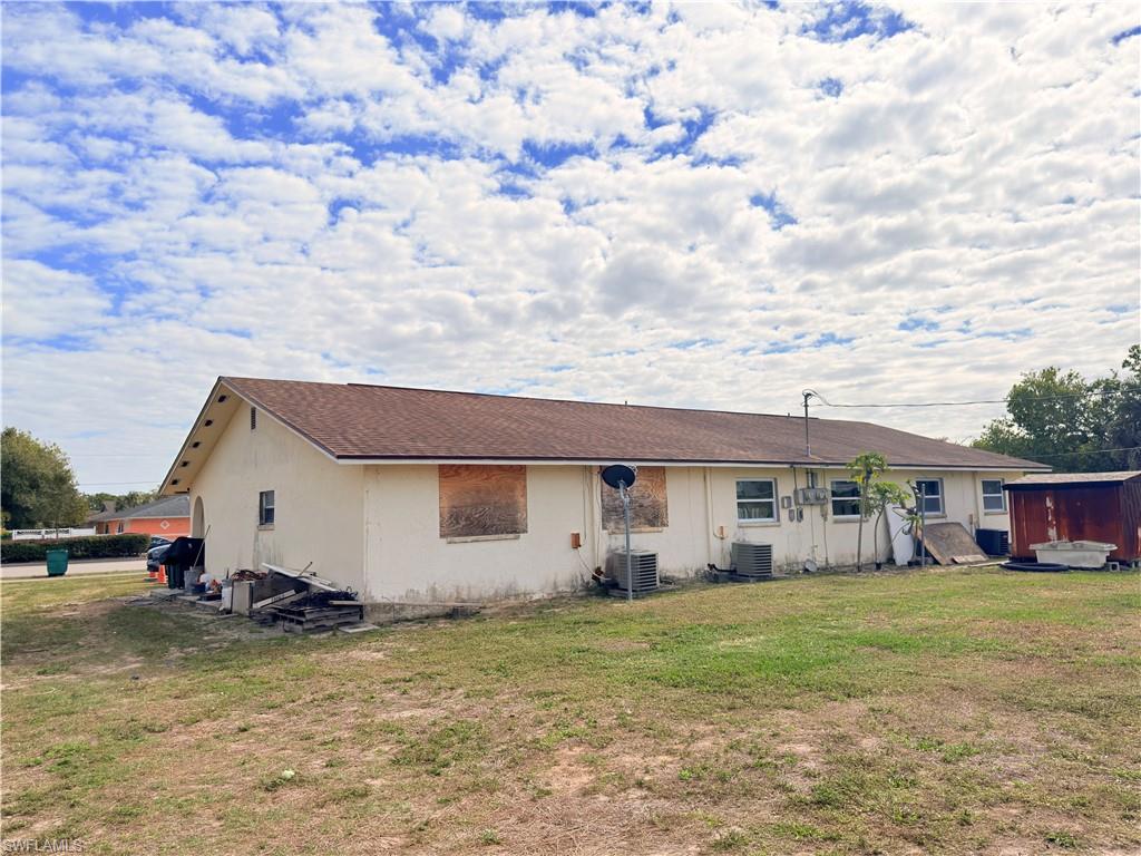 2241 Sunshine Boulevard Naples, FL 34116 - Photo 34 of 35 a view of a house with a backyard